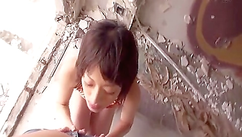 Asian girl with big boobies is outdoors in the yard