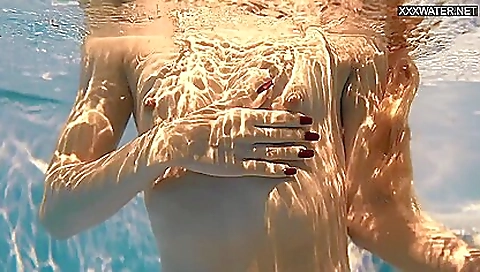 Latvian brunette with big boobs with a sexy bikini in on the beach