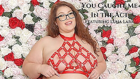 Girl in red dress wearing glasses is wearing her large boobs