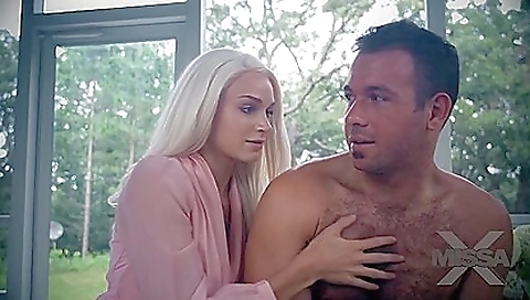 A blonde with a tattoo on her belly is getting fucked