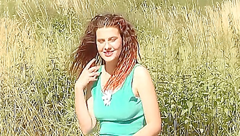 Busty redhead enjoys finger fucking while naked on the bed